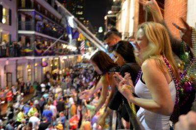 People crowd the balconies and streets of the French Quarter during Mardi Gras 2013
