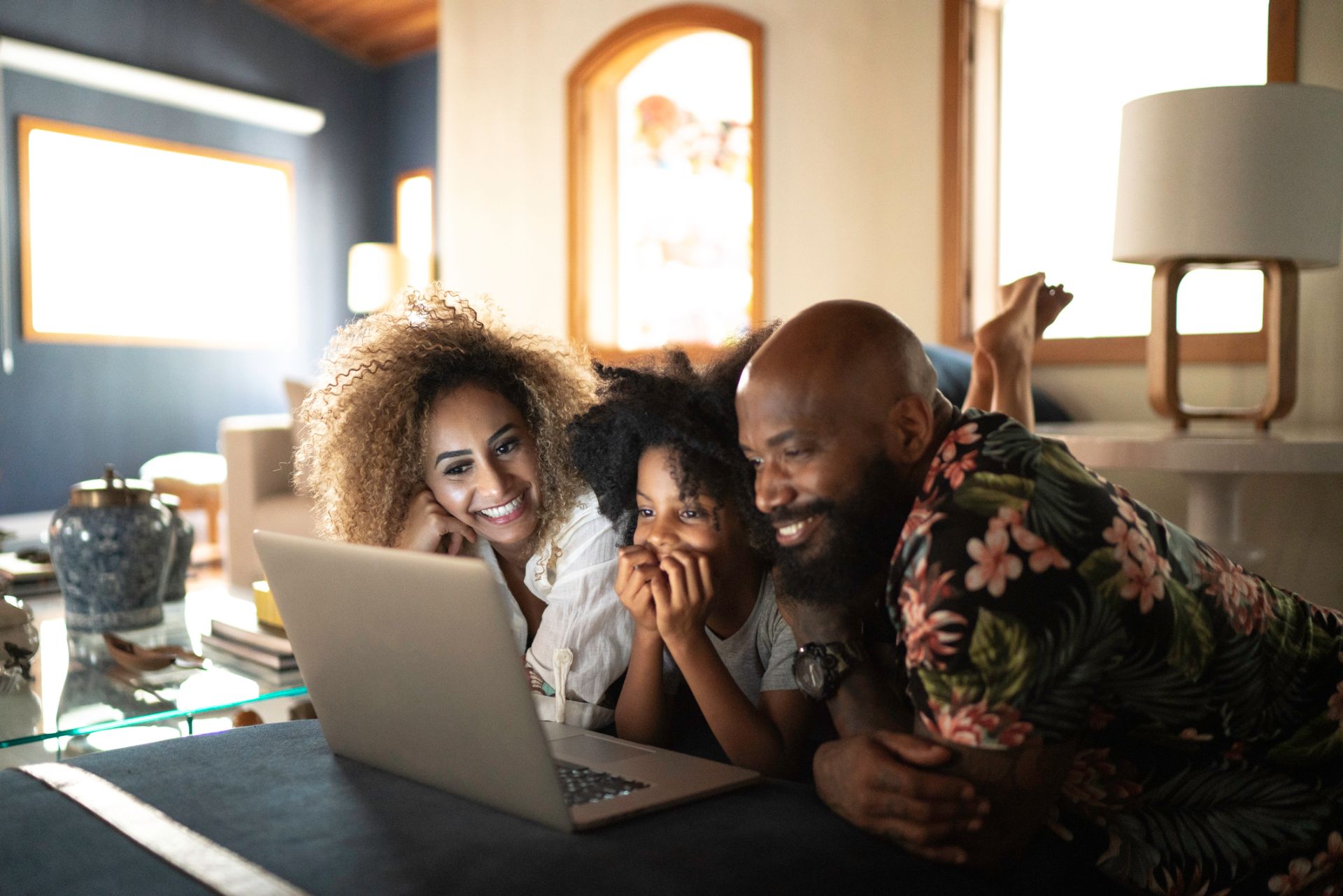 Happy family watching movie on a laptop