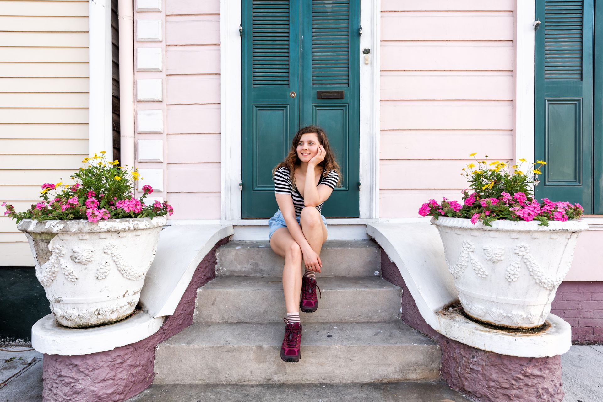 woman sitting smiling happy on stairs steps